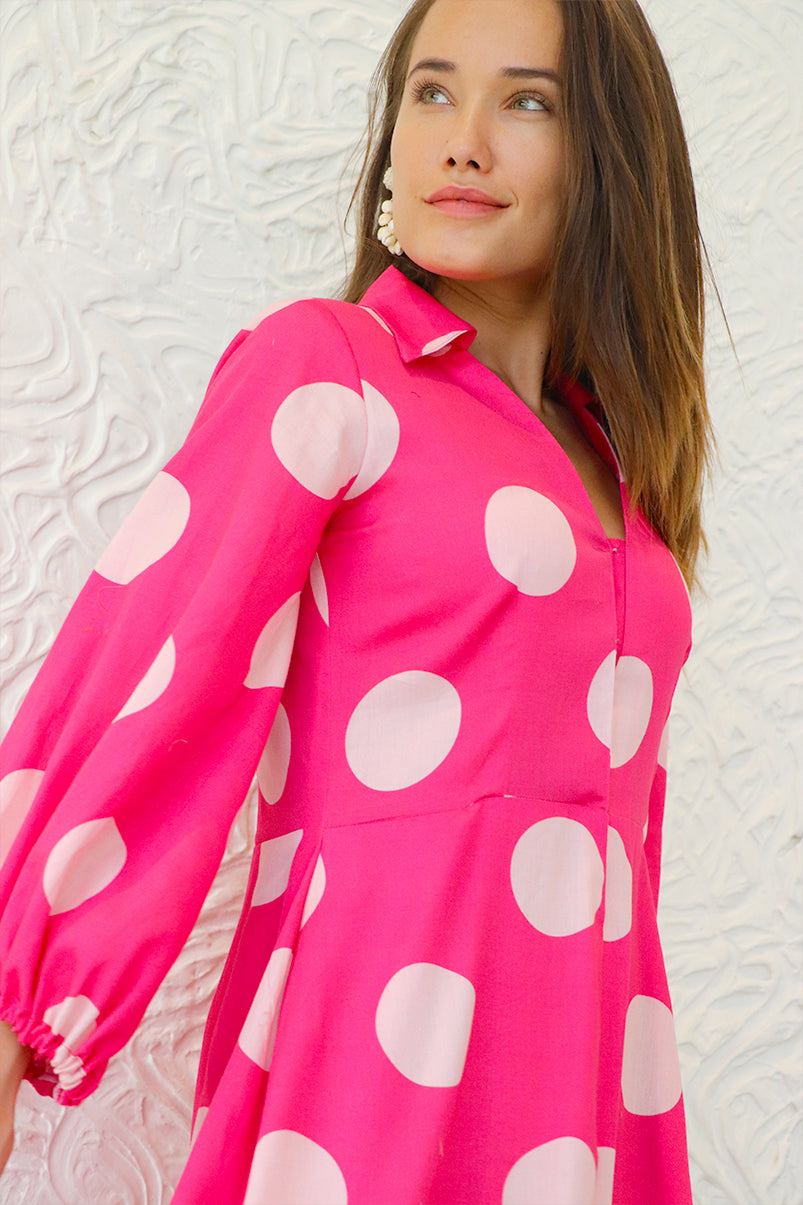 Close-up of Aine's polka dot midi dress, adding volume and movement.